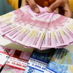 Ilustrasi tumpukan uang rupiah
